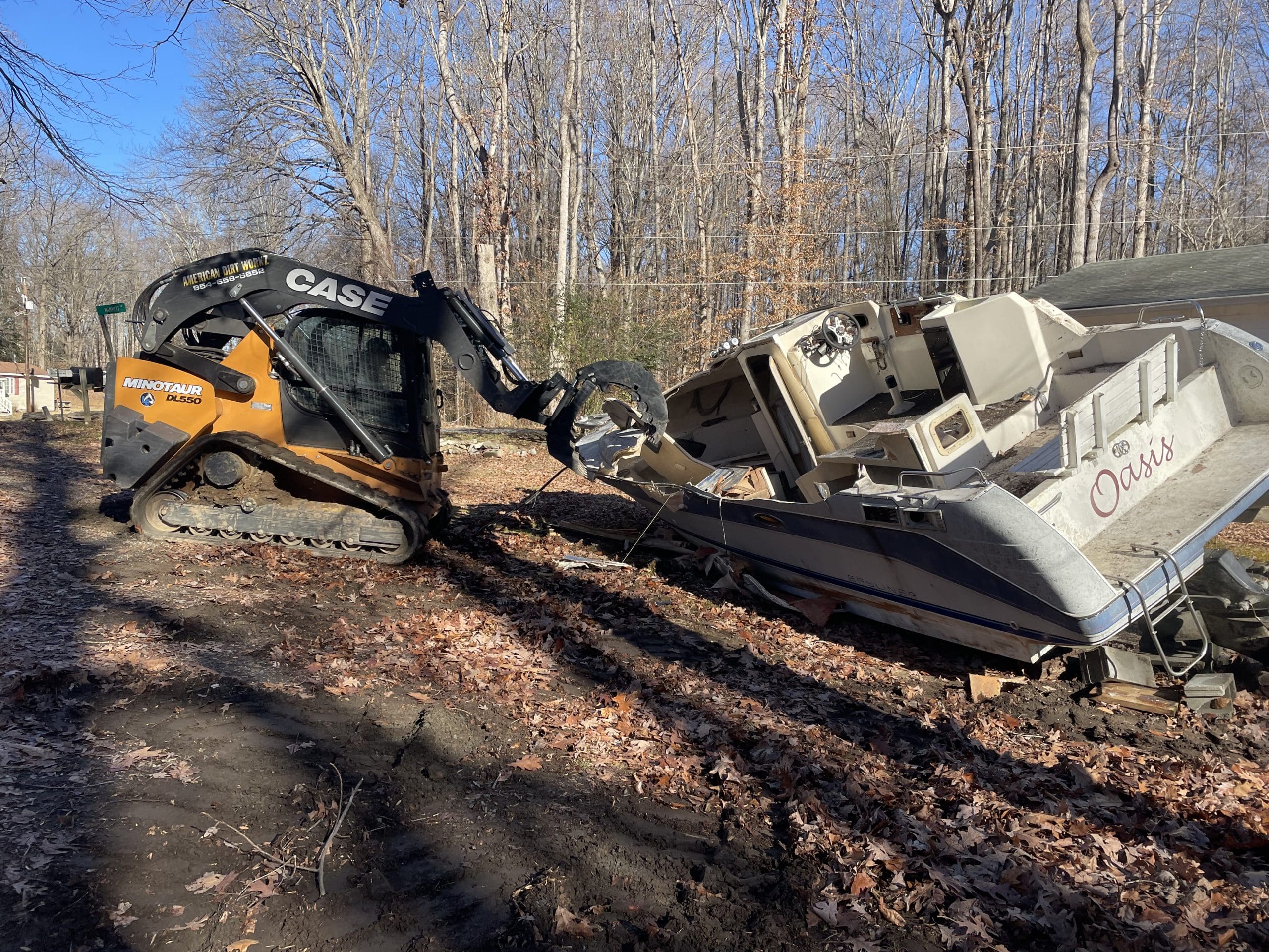 Boat removal and disposal with skid steer and dump truck
