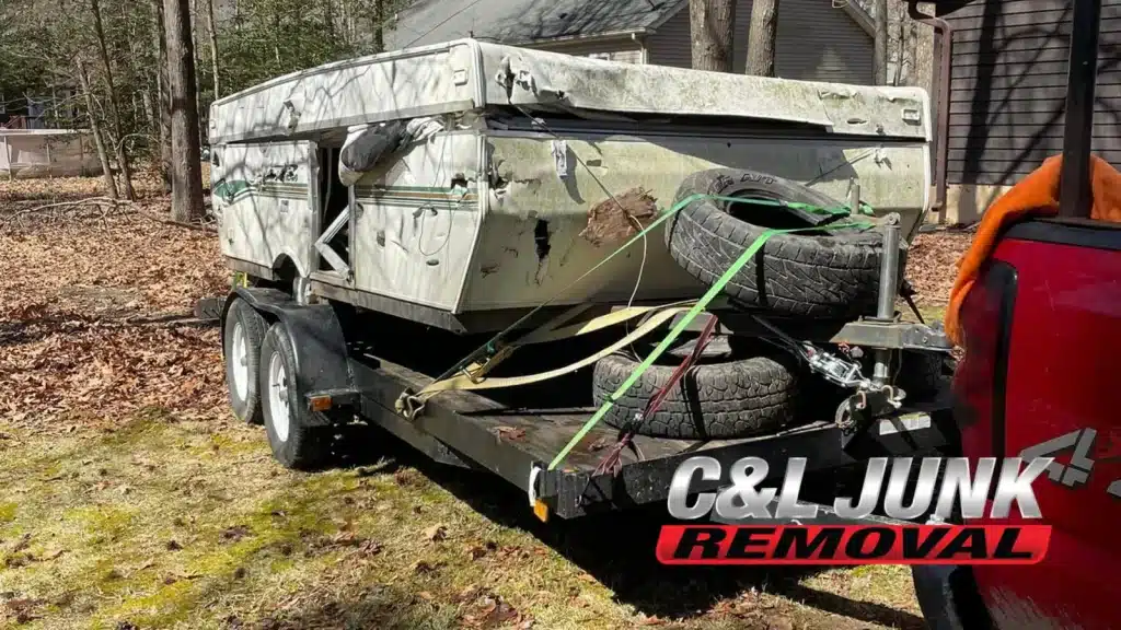 Old trailer with tires and junk